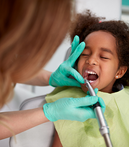 Child receiving a dental exam