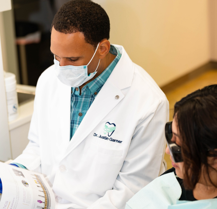 Doctor Justin Garner performing a dental procedure on a patient