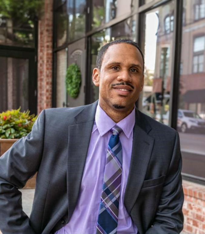 Independence dentist Doctor Justin Garner in a suit