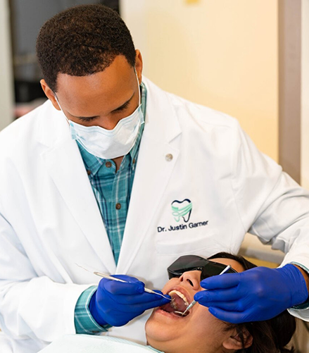 Doctor Justin Garner treating a dental patient