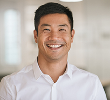 Smiling man in white button up shirt