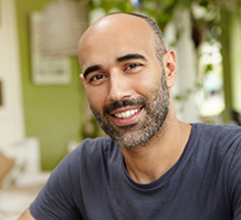 Smiling man in black tee shirt