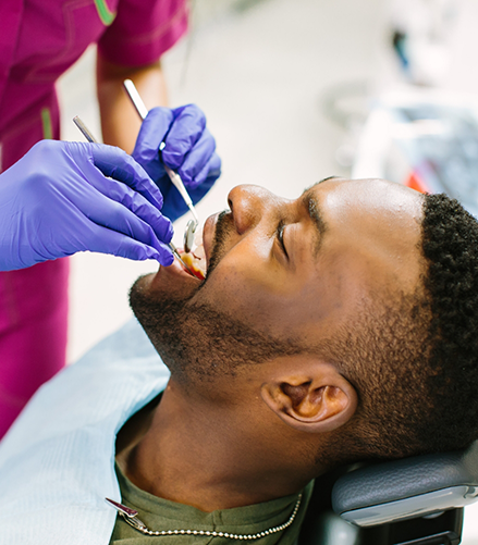 Man receiving a dental checkup