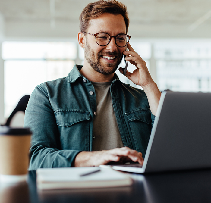 Man talking on phone with dental office in Independence